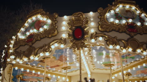 beautiful carousel glowing lights at night festive scene. bright roundabout