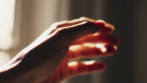 human hand illuminated by light