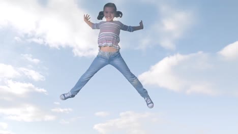 animation of clouds over smiling biracial girl jumping