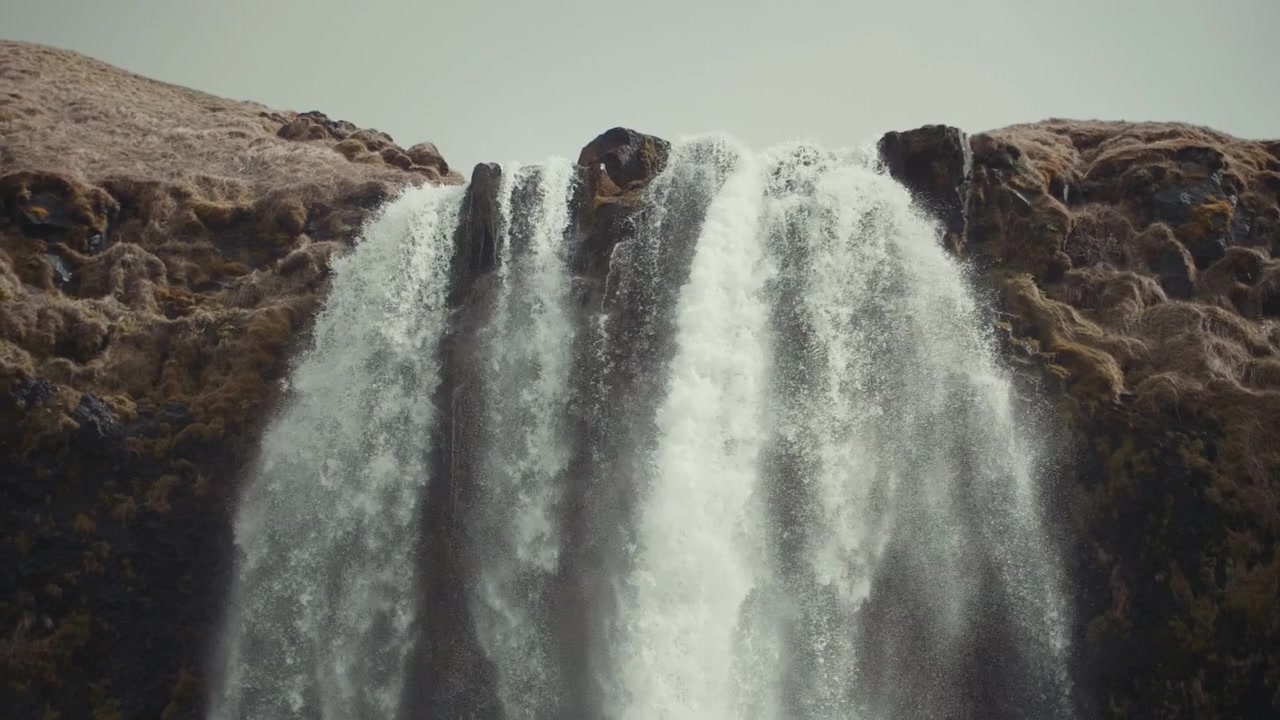Powerful Waterfall Cascading Down a Rocky Cliff