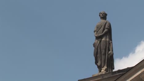 close up of statue on french cathedral of friedrichstadt at gendarmenmarkt, französischer dom, berlin, germany