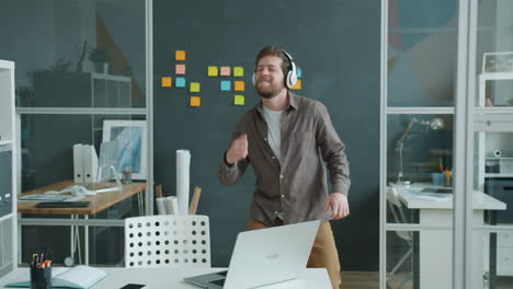 happy man dancing in office