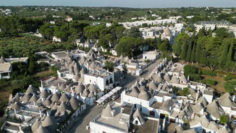 Alberobello-Old-Town-and-White-Trulli-Houses-in-Puglia,-Apulia,-Italy---Aerial-4k