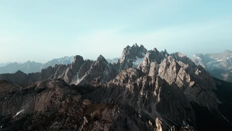 beautiful aerial alpine mountain top range landscape, dramatic blue sky scenery