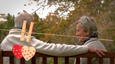 mature couple sitting in a park