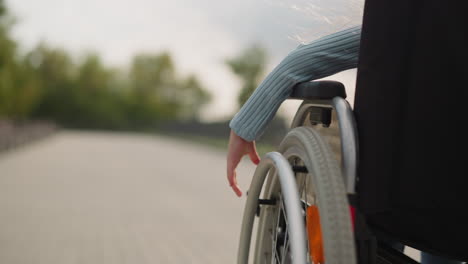 Hand-of-little-girl-turning-wheel-of-medical-equipment