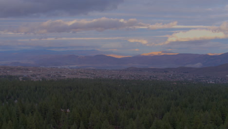 Wide-aerial-panorama-of-forest-of-trees-and-mountains-in-Reno-Nevada