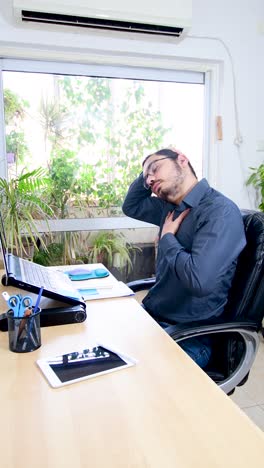 man performing exercises and stretching in front of a laptop. working at home, health concept.