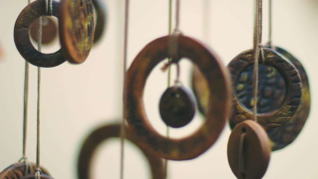 Closeup of antique Chinese coins hanged indoors. Feng shui amulet