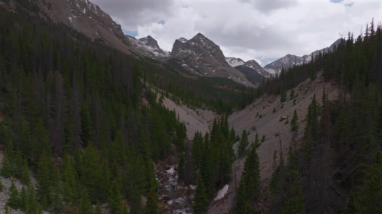Huerfano River valley Blanca Peak Mt Mount Lindsey Lily Lake trail Sangre de Cristo Range Colorado aerial drone spring Summer San Isabel forest Iron Nip ple Rocky Mountains gray clouds forward pan up