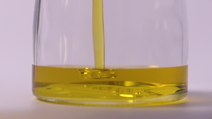 Slow Motion Extreme Close Up Food Oil Pouring In Jar