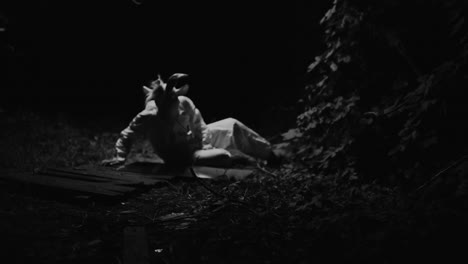 goat mask figure in the forest at night
