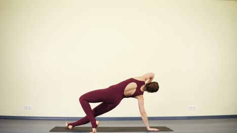 young attractive woman practising yoga asanas to stay fit and healthy. downward dog.