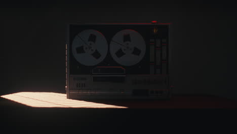 a vintage tape recorder in a red blinking light