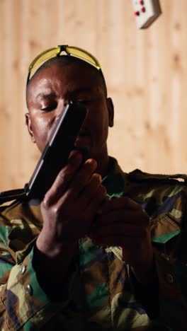 vertical video military officer instructing soldiers on how to load ammunition into pistol