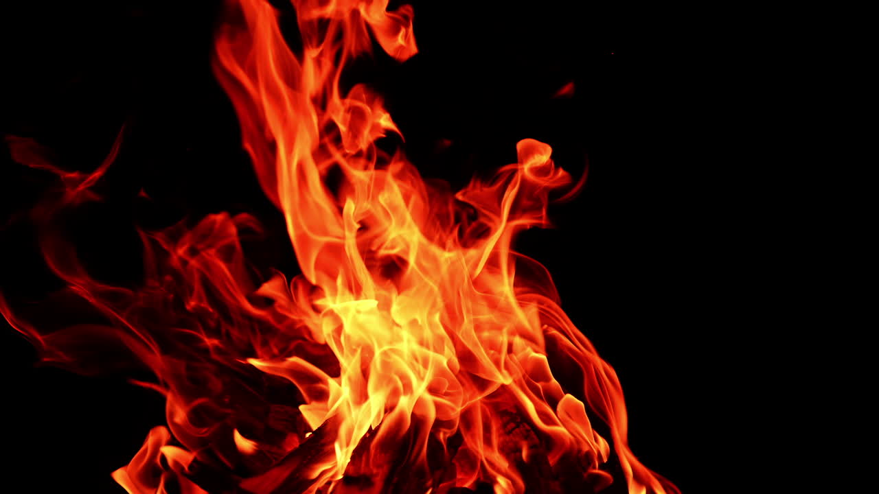 Fire blaze with red flame. Hot fireplace glowing with orange burn.