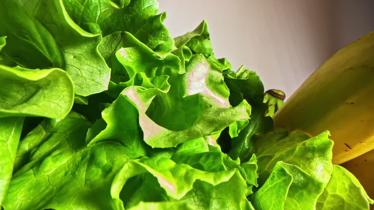 Close-up of fresh lettuce and ripe bananas, showcasing healthy eating
