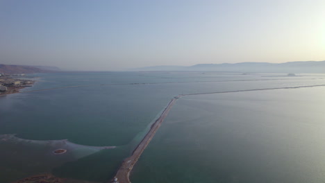 Slow-drone-shot-over-the-drainage-basins-of-the-Dead-Sea-with-beautiful-colors