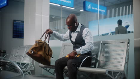 man waiting in airport lounge