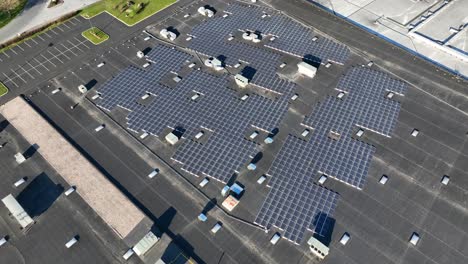 Wide-shot-of-rooftop-solar-panel-installation-on-industrial-building