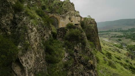 approaching ruins of tmogvi fortress in mountains on kura riverbank, samtske-javakhet, aspindza, georgia