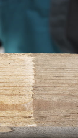 close-up of wood plank with a tool