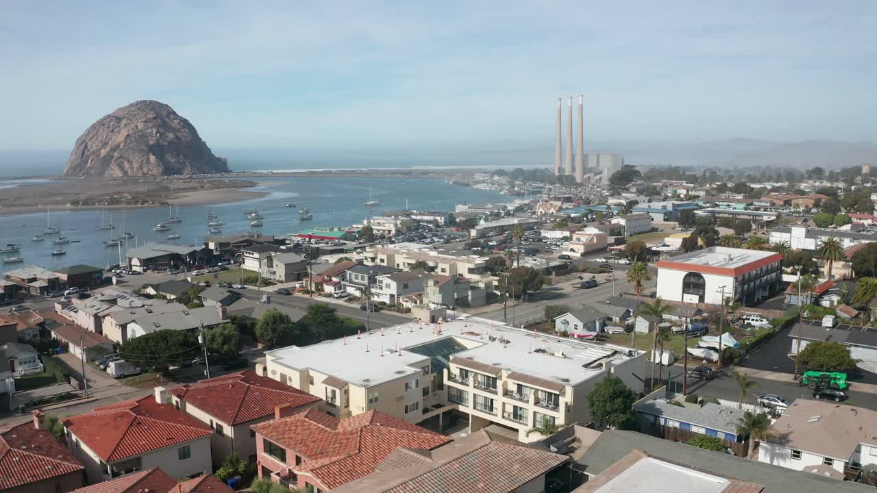 Low panning aerial shot of Morro Bay along California's Central Coast. 4K