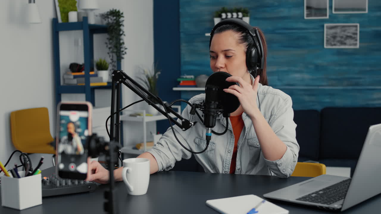 Popular content creator taking a video with smartphone while telling a story