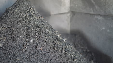 Coal-slag-grains-onto-pile-in-industrial-plant-storage