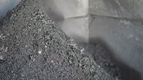 coal slag grains onto pile in industrial plant storage