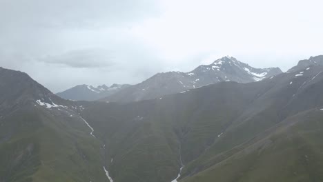 scenic view of the greater caucasus mountain range down the river roshka in georgia