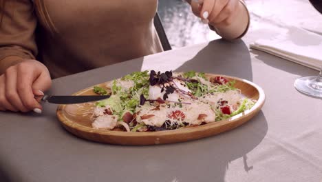 woman eating caesar salad