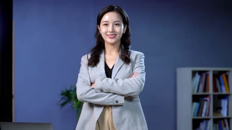 Portrait of intelligent confident beautiful professional business woman standing in office. Happy female company executive smiling businesswoman entrepreneur corporate leader manager looking at camera