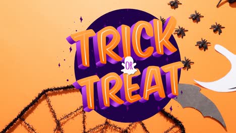 Animation-of-trick-or-treat-text-over-spiders