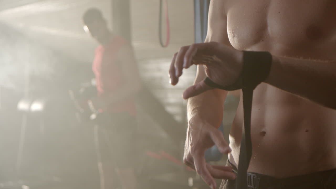 Man wrapping hands at the gym