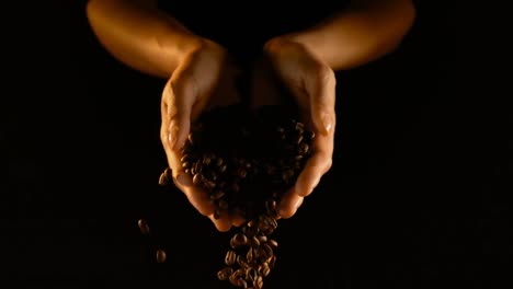 coffee beans falling from hands 4k