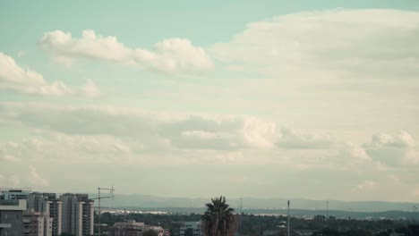 beautiful time lapse over the city, was shot from the roof, israel tel aviv, middle east, colorful surfing clouds, golden hour, cityscape, sony 4k video