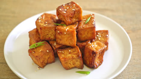 fried tofu with white sesame and teriyaki sauce - vegan and vegetarian food style