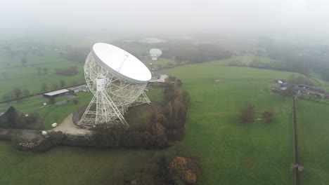 aerial jodrell bank observatory lovell telescope misty rural countryside front to side orbit left