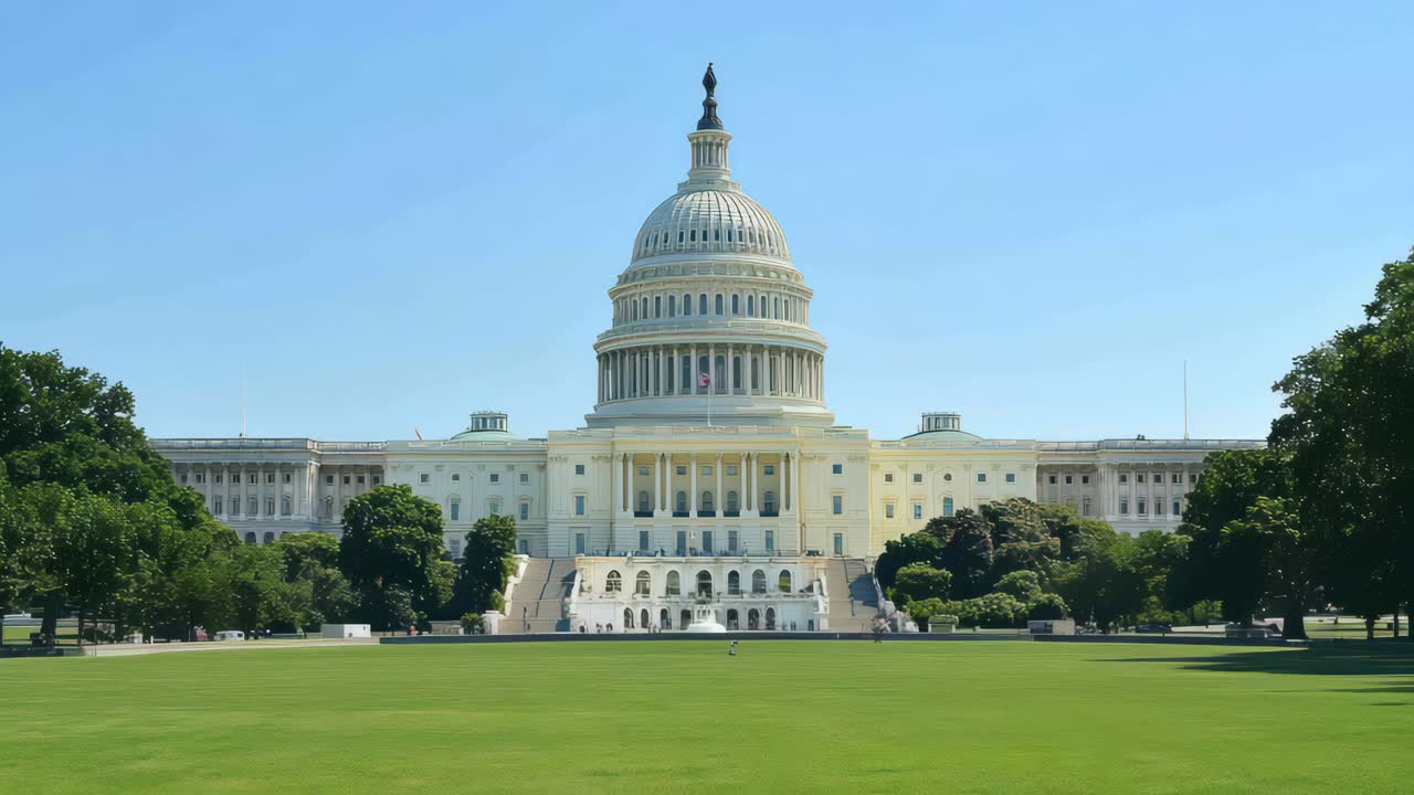 Wide-angle shot of the U.S. Capitol building under a clear blue sky, ideal for a video