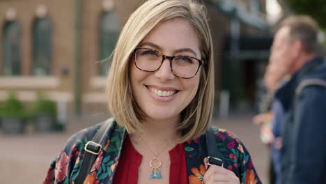 portrait-of-trendy-young-blonde-woman-smiling-confident-optimistic-wearing-glasses-floral-shirt