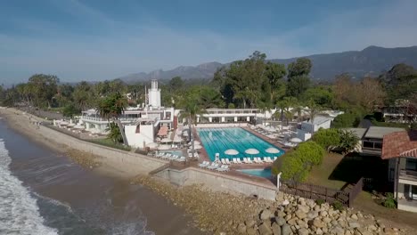 beautiful aerial of butterfly beach the pacific and the coral casino in montecito california 3