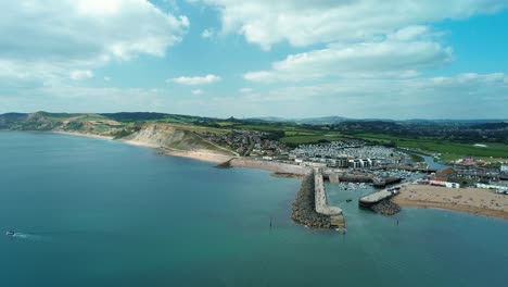 bridport harbour at west bay, dorset in england - aerial orbit establisher