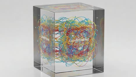 a captivating 3d art piece featuring colorful entangled wires within an elegant display cube, symbolizing connectivity and dynamic interactions in modern design