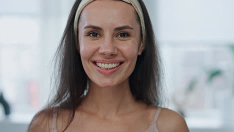 Morning-model-rinsing-mouth-smiling-at-home-mirror-pov-portrait.-Lady-hygiene