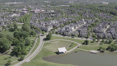 aerial view of the norton commons neighborhood in louisville, kentucky, featuring homes and a small pond. great for real estate, urban design, and regional footage.
