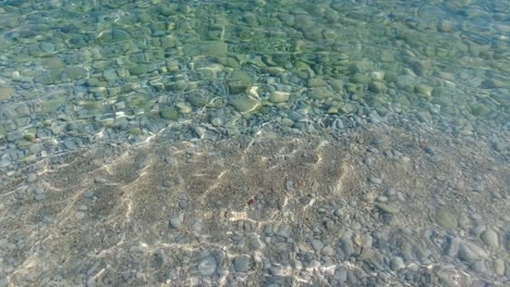 clear water and pebbles on the seabed