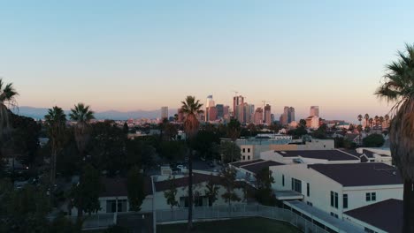 aerial los angeles palm trees flythrough city america cali california golden hour