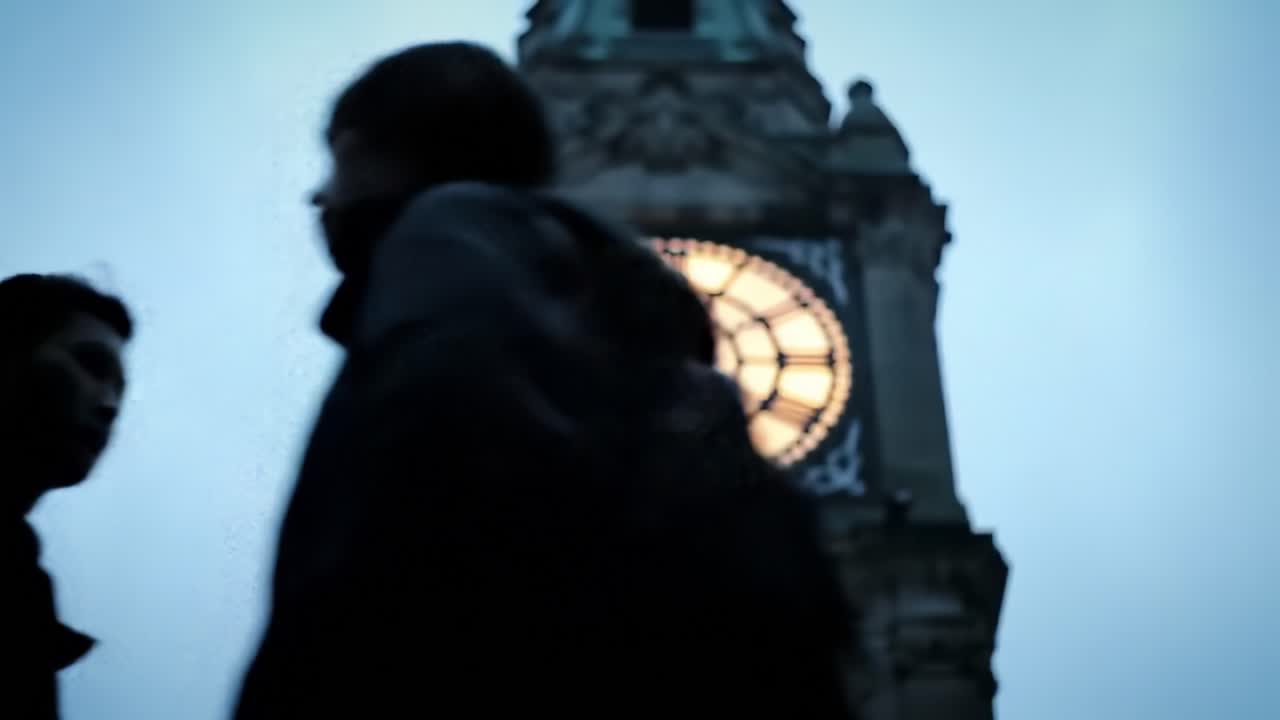 A Captivating View of a Majestic Tower Clock Against a Dusk Sky, Highlighting the Intricate Details and Illuminated Faces of the Timepiece.