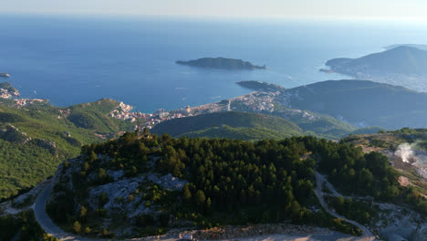 establishing drone shot the of bečići city from the mountains, in montenegro